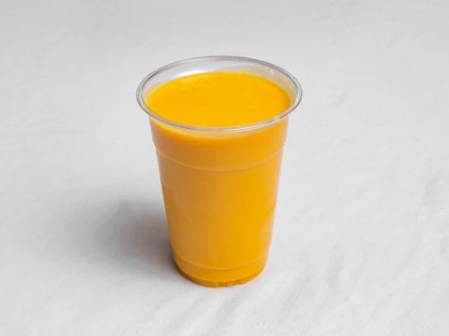 Refreshing lassi, mango lassi, fresh juices, and cola served in chilled glasses with vibrant garnishes.